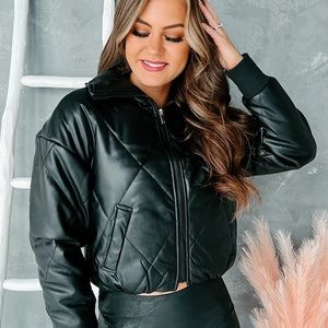 Black leather jacket with Sherpa lining.